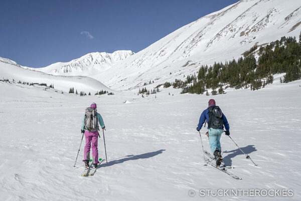 Christy and Michael Stevens heading up Big WIllis Gulch towards Mount Blaurock, out in the distance.