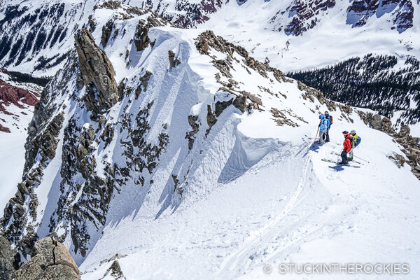 The ski group scouting the couloir on Willow Peak