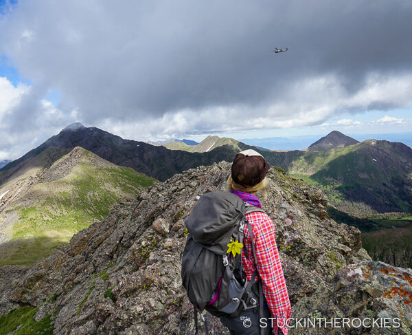 Christy mahon on Point 13541 with a SAr helicopter in the distance