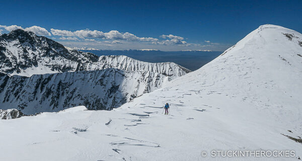 Skinning the ridge betweent he two summits of Twin Peaks A