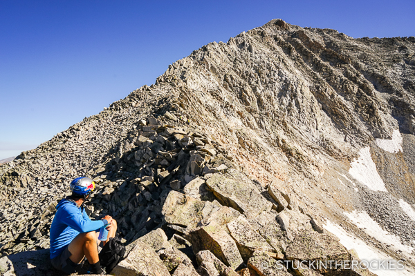 Chris Davenport taking a moment and assessing the upper part of the ridge.