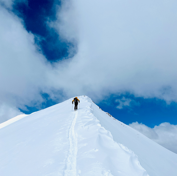 Ted Mahon skinning to the summit of Peak 10.