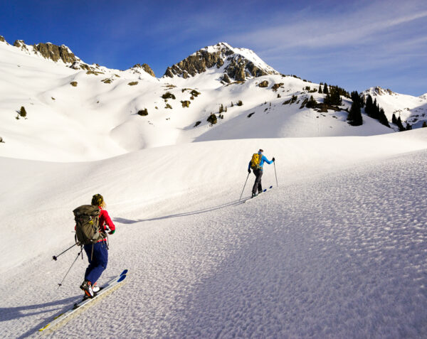  Skinning to a ski objective on frozen spring snow.
