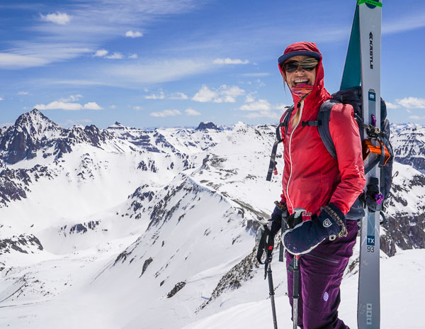 On the summit of T 0 with Sneffels, Teakettle, and Potosi in the background.