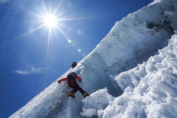 Crossing a crevasse on Illimani.